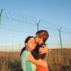 release of prisoners on state border happy child kissing mother after refugee family reunion