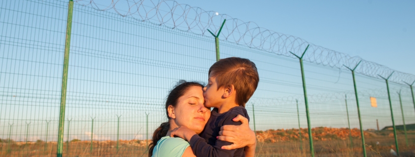 release of prisoners on state border happy child kissing mother after refugee family reunion