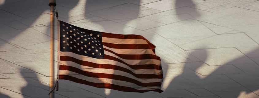 Shadows of people and the American flag, conceptual photography