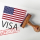 United States Visa Approved with Rubber Stamp and flag