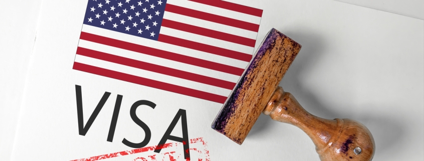 United States Visa Approved with Rubber Stamp and flag