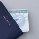 United States passport, permanent resident card (green card) on desk . Immigration concept