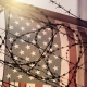 American flag and barbed wire, USA border